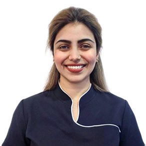 A smiling Dr Mamta Soni in a dental uniform. Dr Mamta Soni is a General Dentist with a special interest in Cosmetic Dentistry and Extractions.